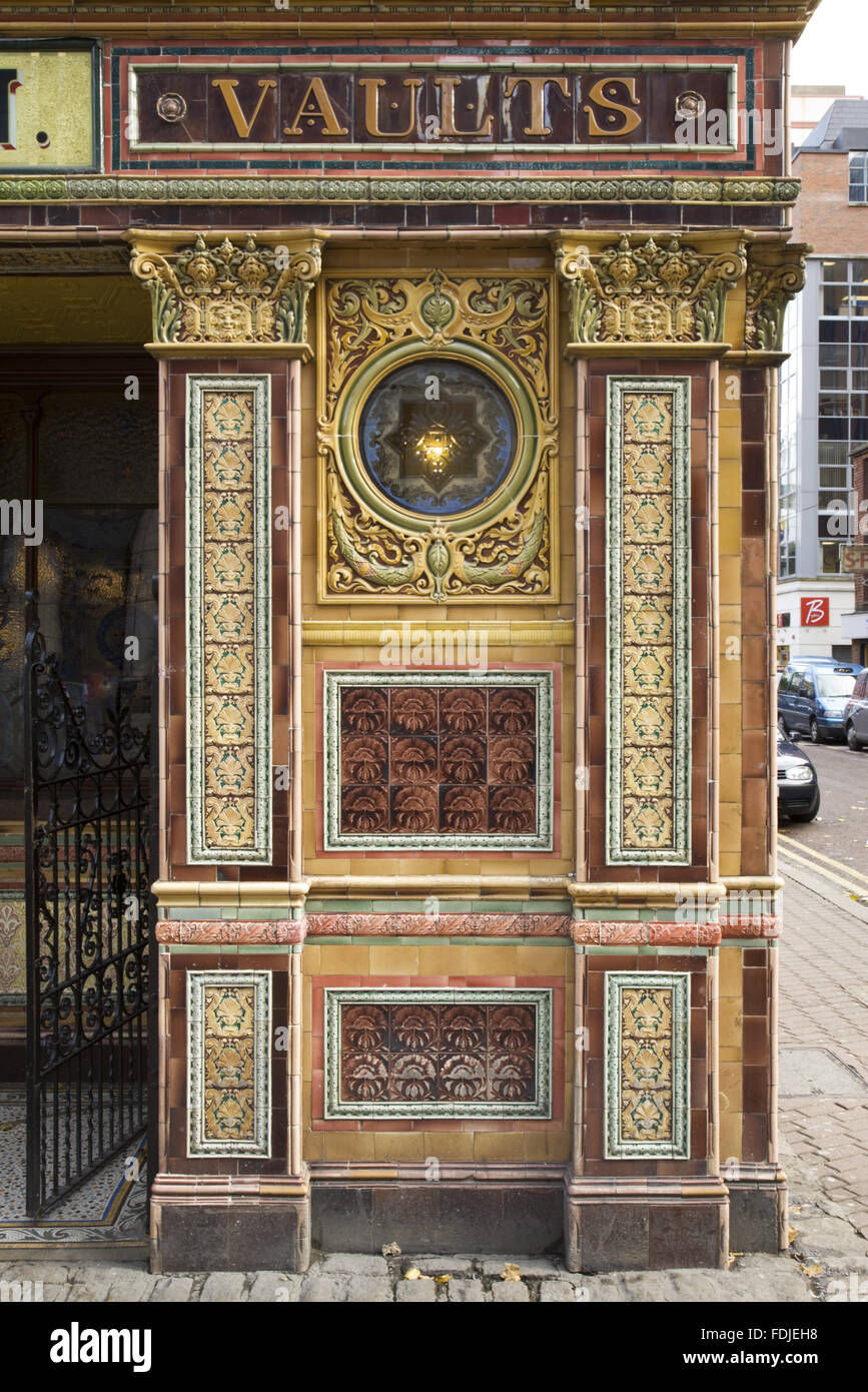 Close view of the exterior tiling at The Crown Bar, Great Victoria Street, Belfast. Formerly known as the Crown Liquor Saloon, the pub building dates from 1826 but the wonderful late Victorian craftsmanship of the tiling, glass and woodwork undertaken by Stock Photo