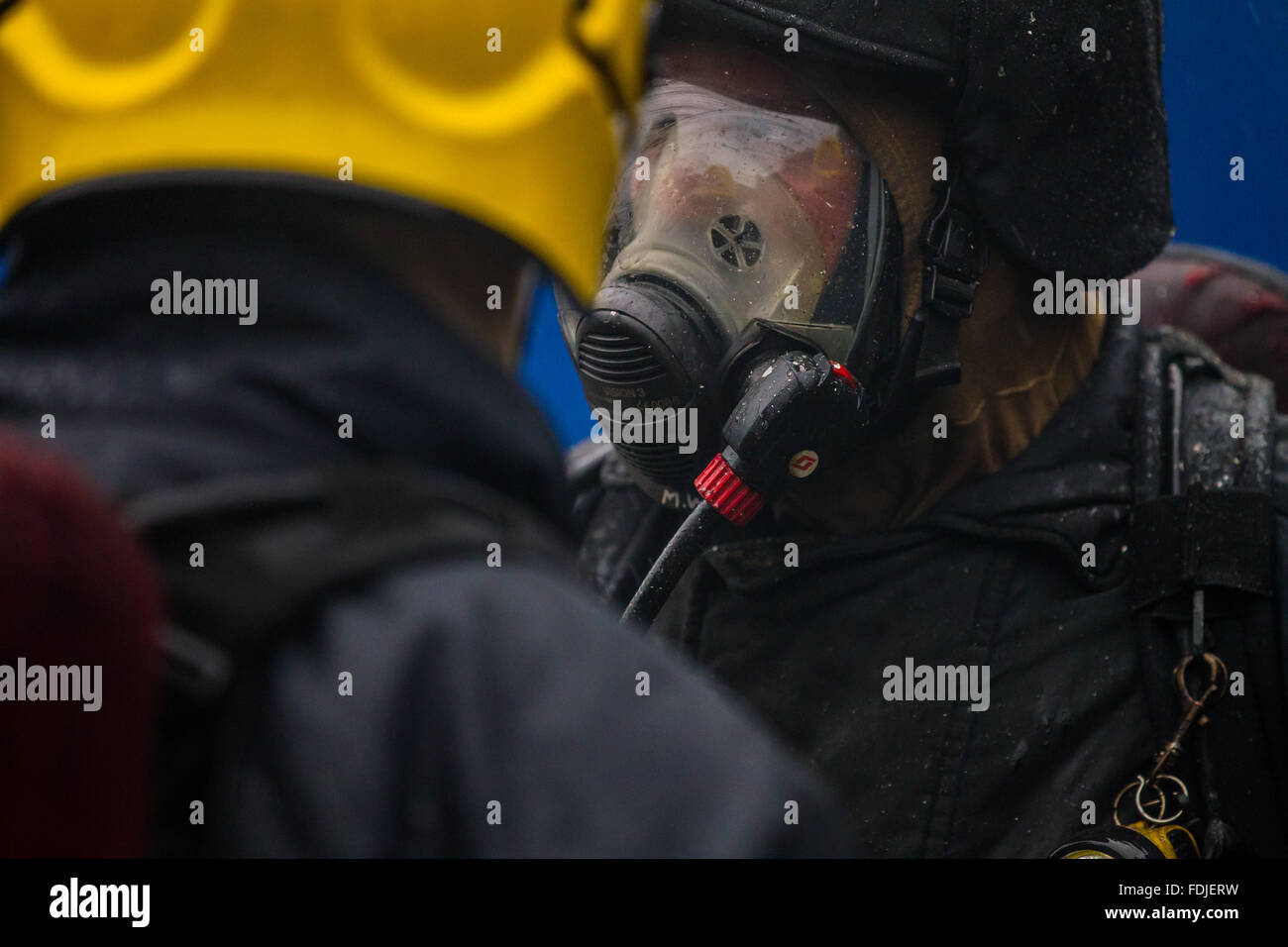 Seafarers and offshore workers during firefighting training Stock Photo