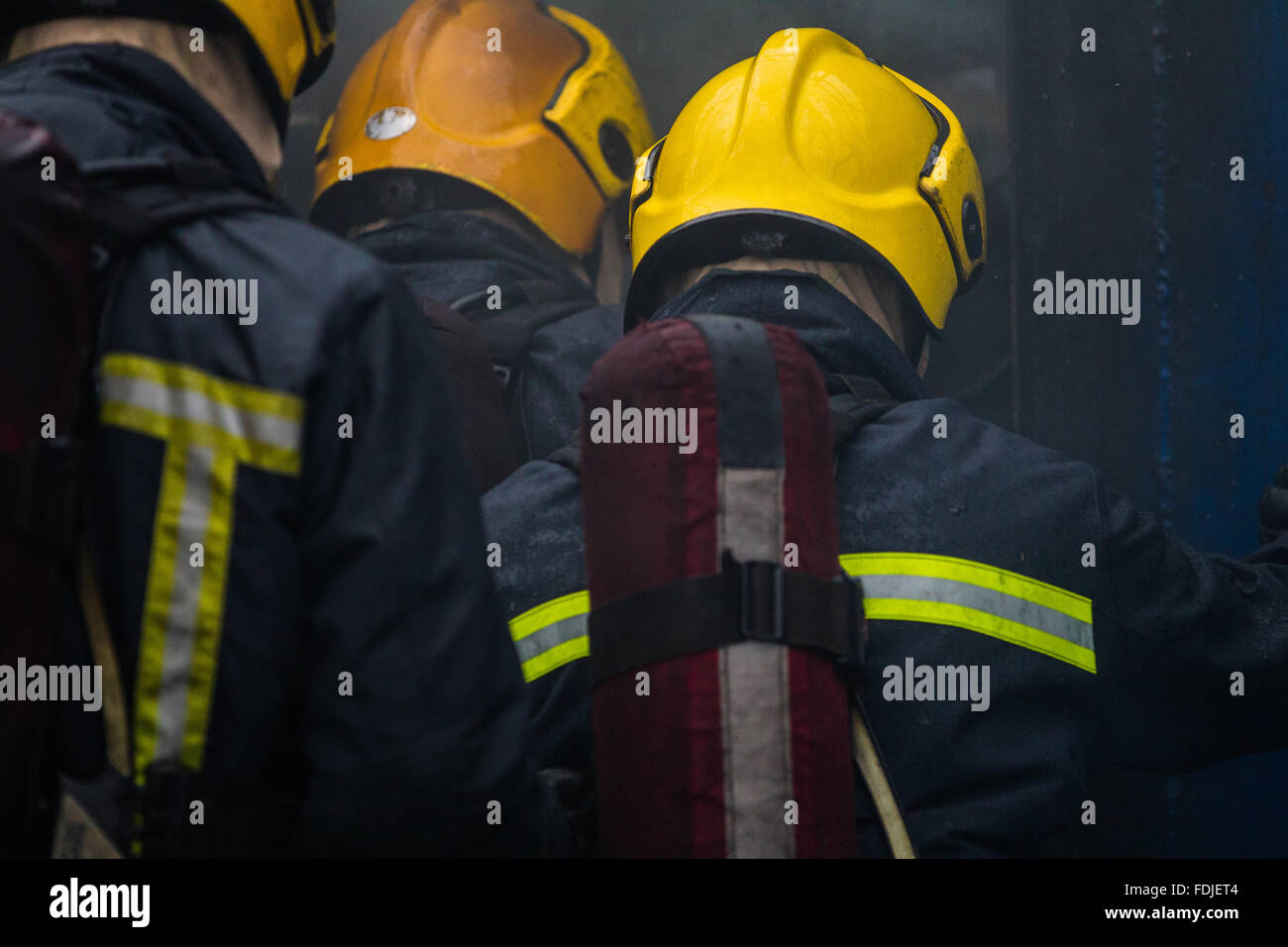 Seafarers and offshore workers during firefighting training Stock Photo