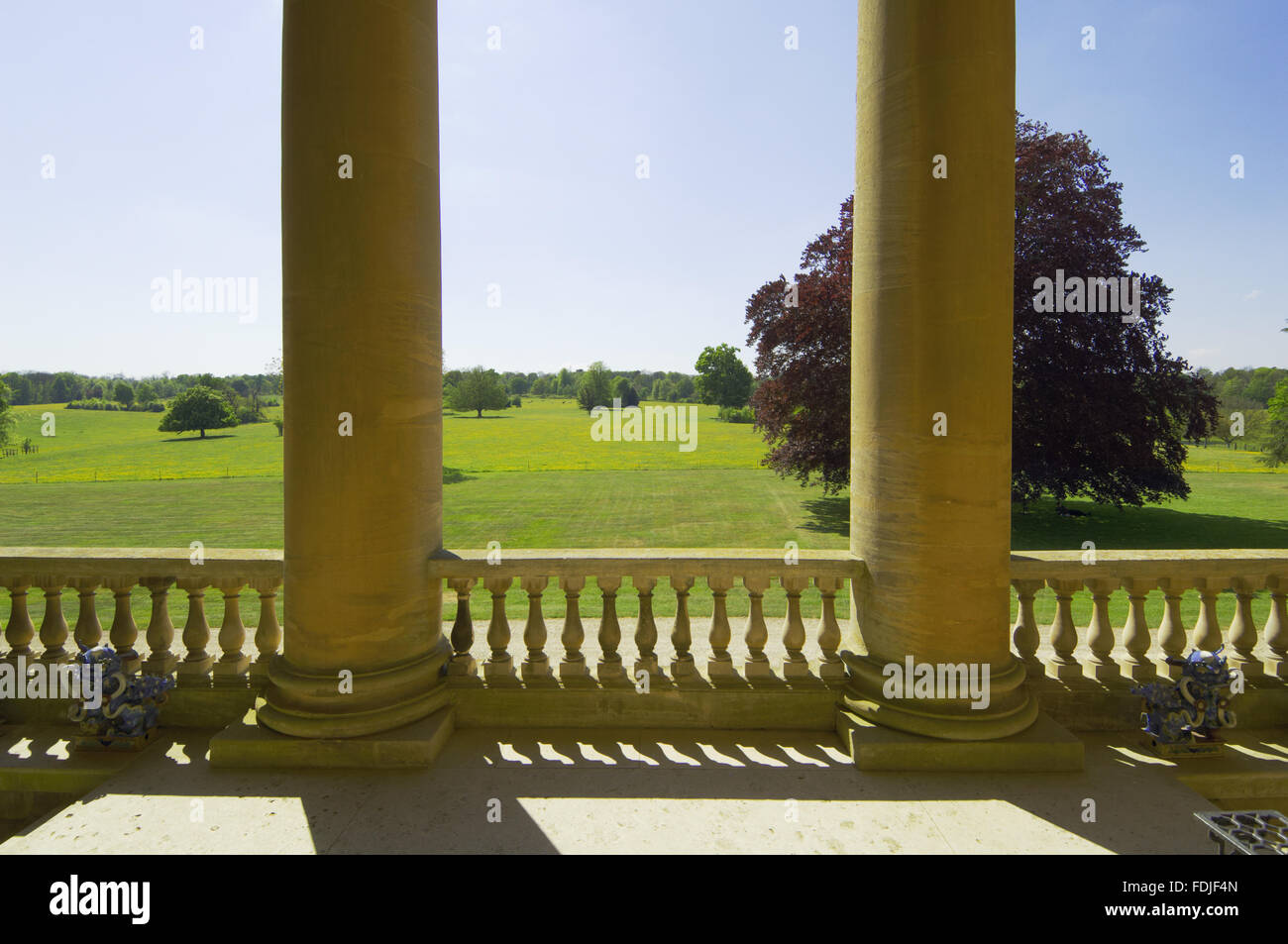 View from the recessed Ionic portico over the lawn to the West front at  Basildon Park, built 1776-83 by John Carr for Francis Sykes, at Lower Basildon, Reading, Berkshire. Stock Photo