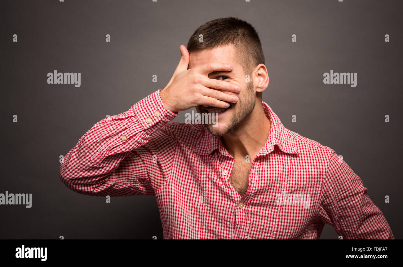 Man covering eyes his face Stock Photo - Alamy