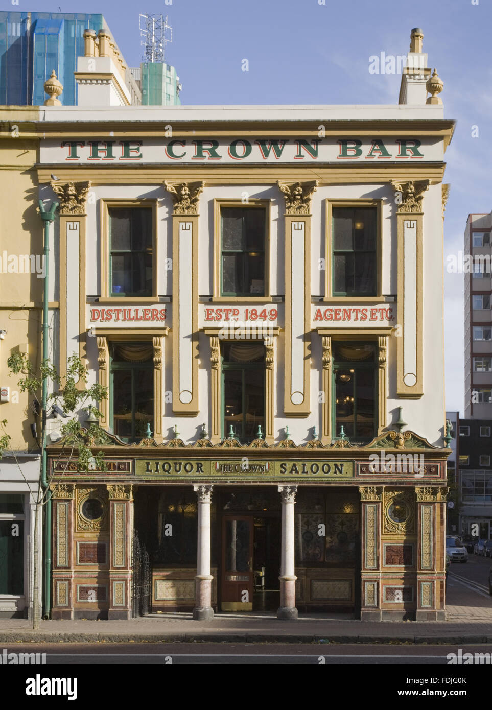 The Crown Bar, Great Victoria Street, Belfast. Formerly known as the Crown Liquor Saloon, the pub building dates from 1826 but the wonderful late Victorian craftsmanship of the tiling, glass and woodwork undertaken by Italian workers dates from 1898. Stock Photo