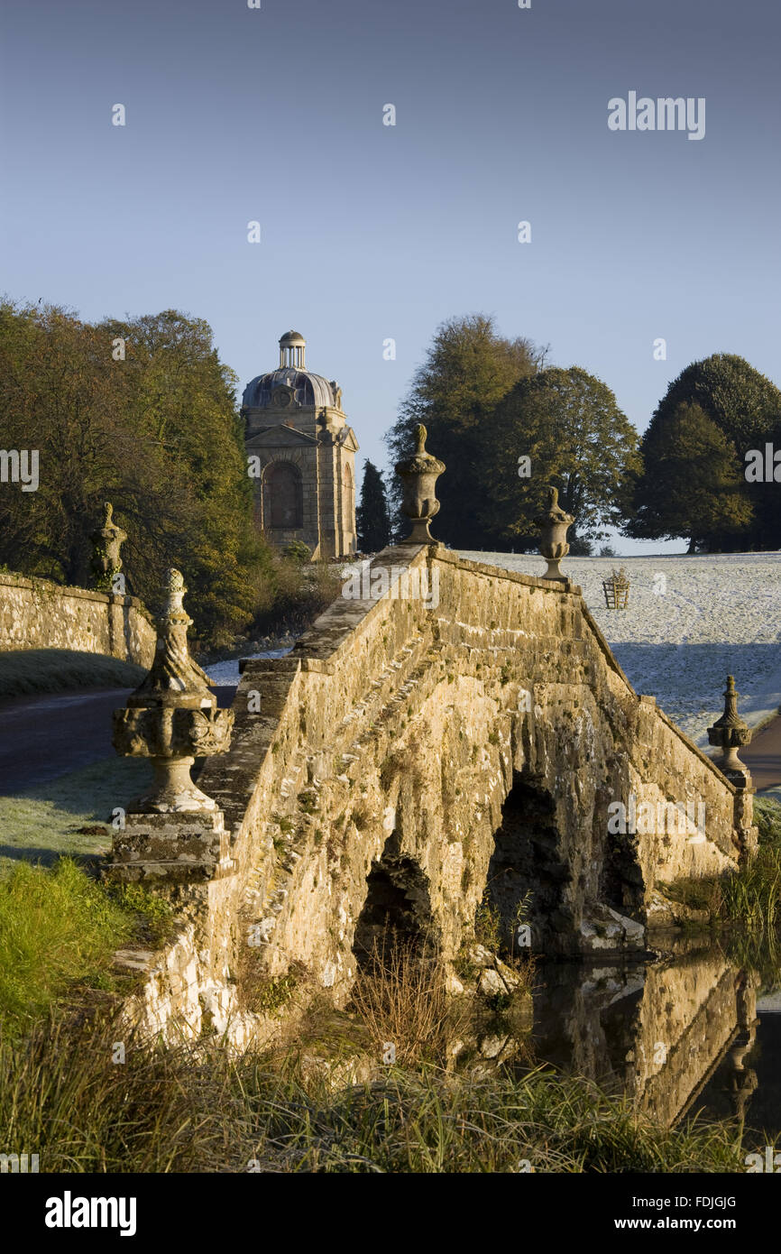 The Oxford Bridge with urns and rustic stonework on a frosty day at Stowe Landscape Gardens, Buckinghamshire. Stock Photo