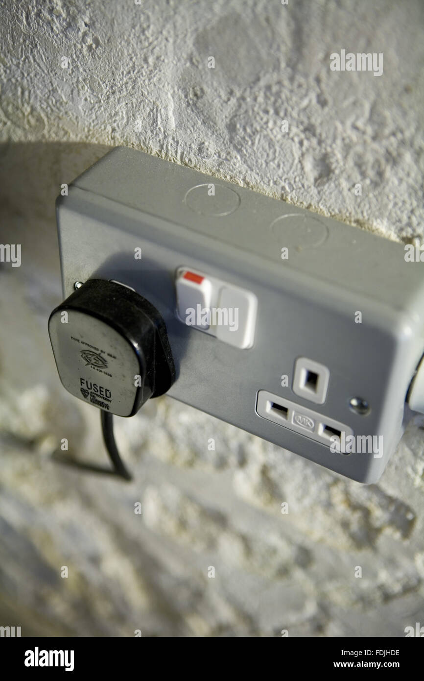 Electricity socket and plug at Petworth House, West Sussex Stock Photo ...