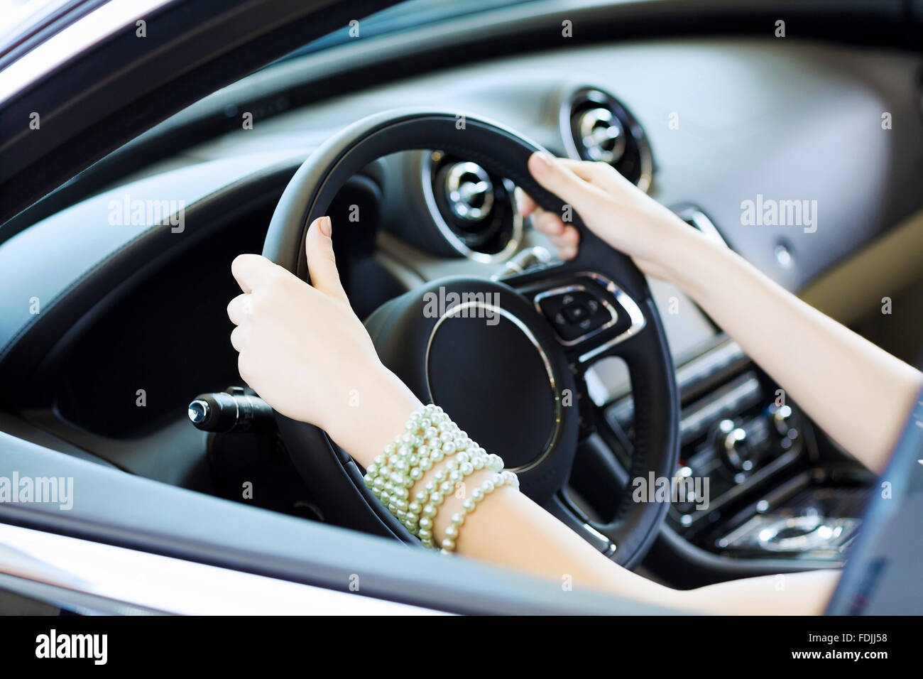 Close up of woman hands driving a car Stock Photo Alamy