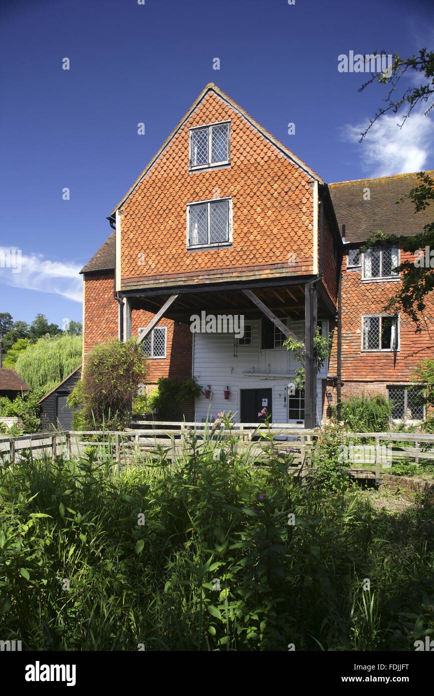 Shalford Mill on the Tillingbourne river, a tributary of the River Wey, Surrey. The watermill is eighteenth century and is one of the properties presented to the National Trust by the Ferguson Gang. Stock Photo