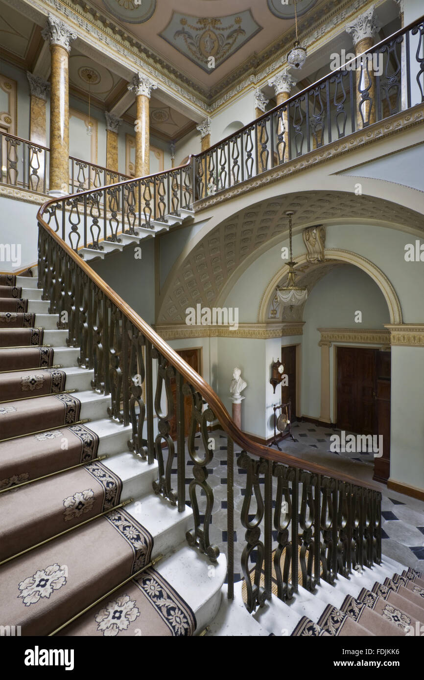 The sweeping staircase with bronzed balustrading in the Staircase Hall at Berrington Hall, Herefordshire Stock Photo