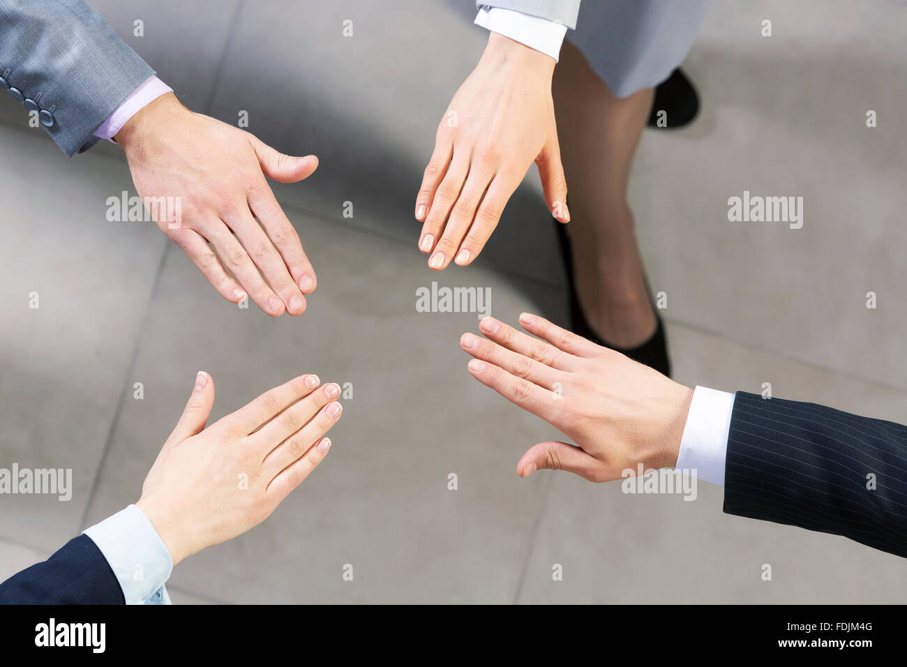 Close up of business peoples hands on top of each other Stock Photo - Alamy