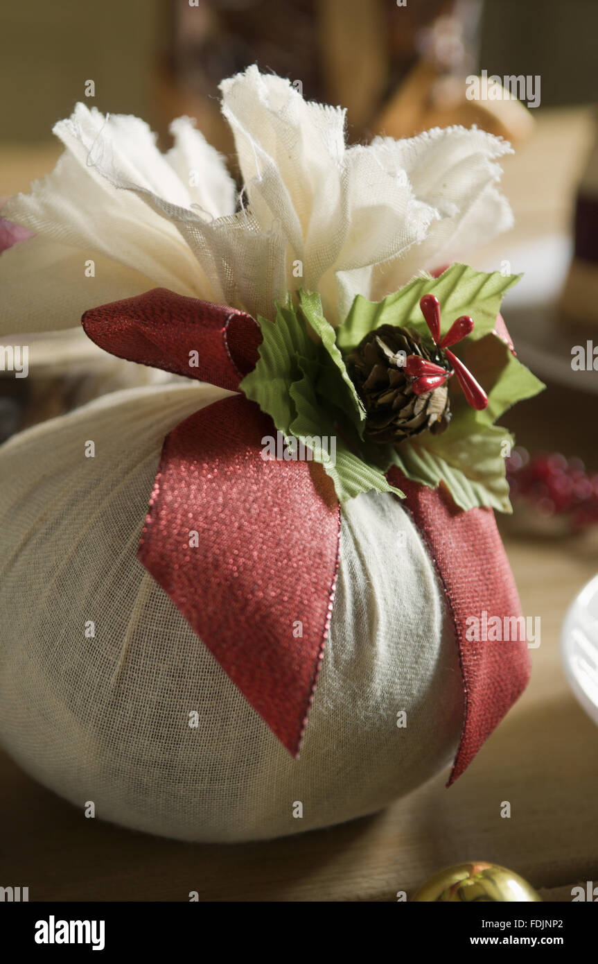 A Christmas pudding wrapped in a muslin cloth. Stock Photo