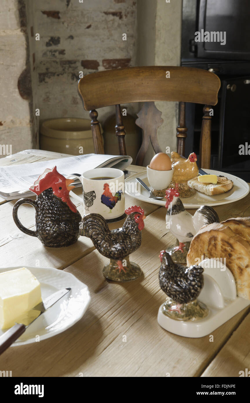 A range of ornamental chicken table ware including a toast rack and mug. Stock Photo