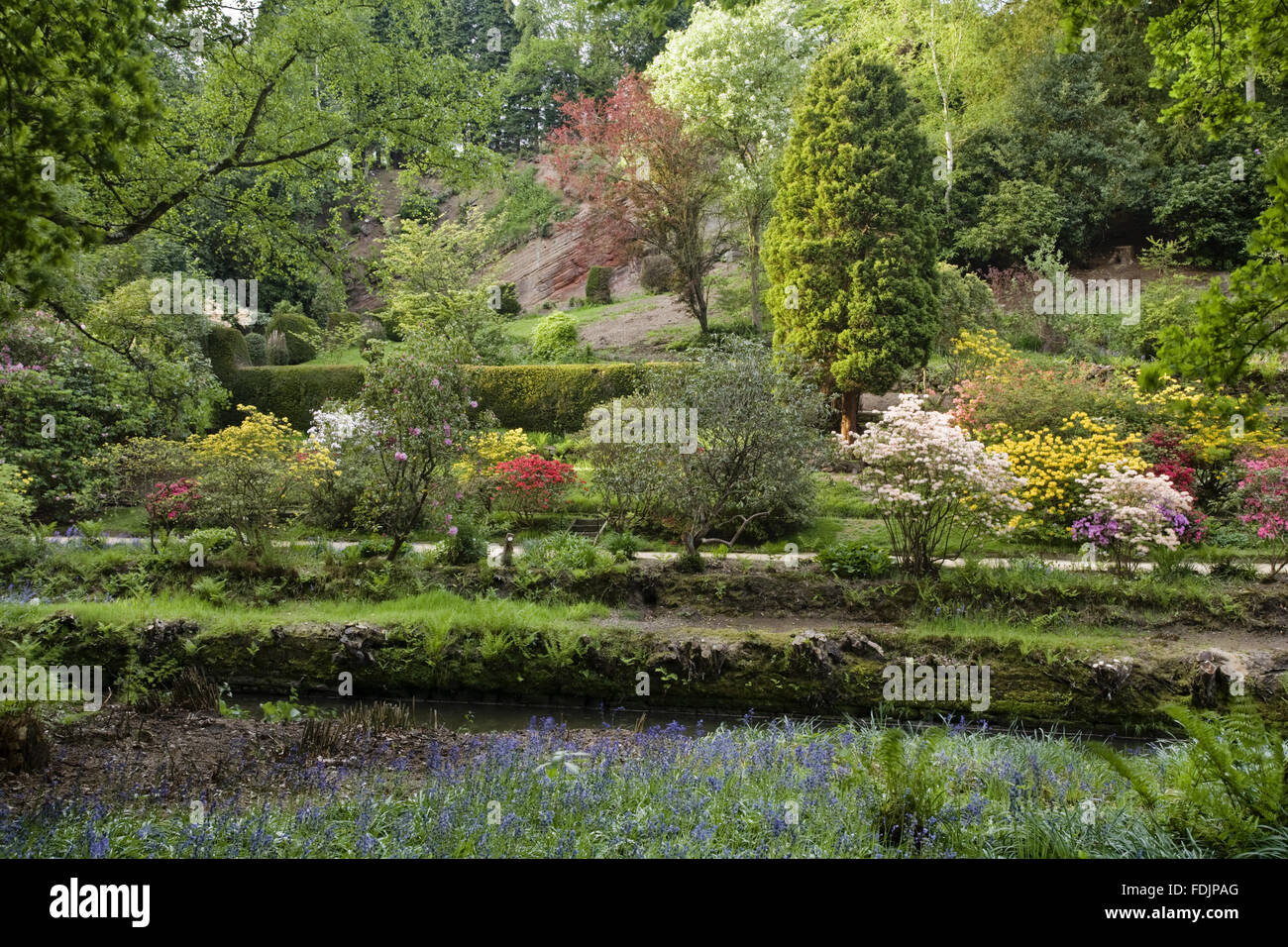 The river and garden which was created in the late eighteenth century by Samuel Greg, the mill owner, and his wife Hannah, to complement their house. The garden follows the valley of the Bollin river and is part of the Quarry Bank Mill and Styal Estate, W Stock Photo