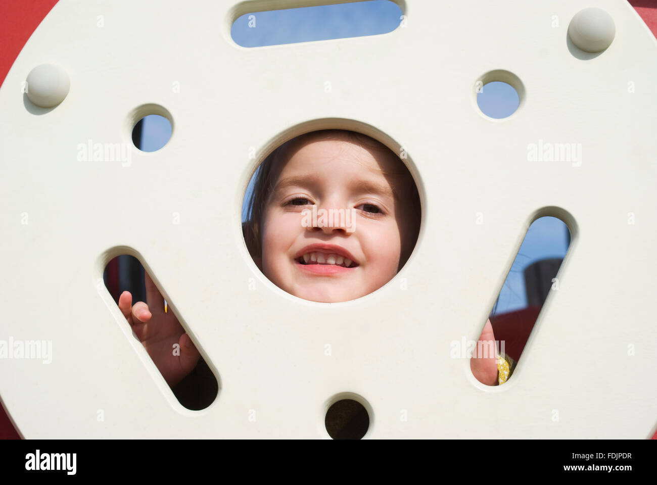 Happy little girl on the playground Stock Photo - Alamy