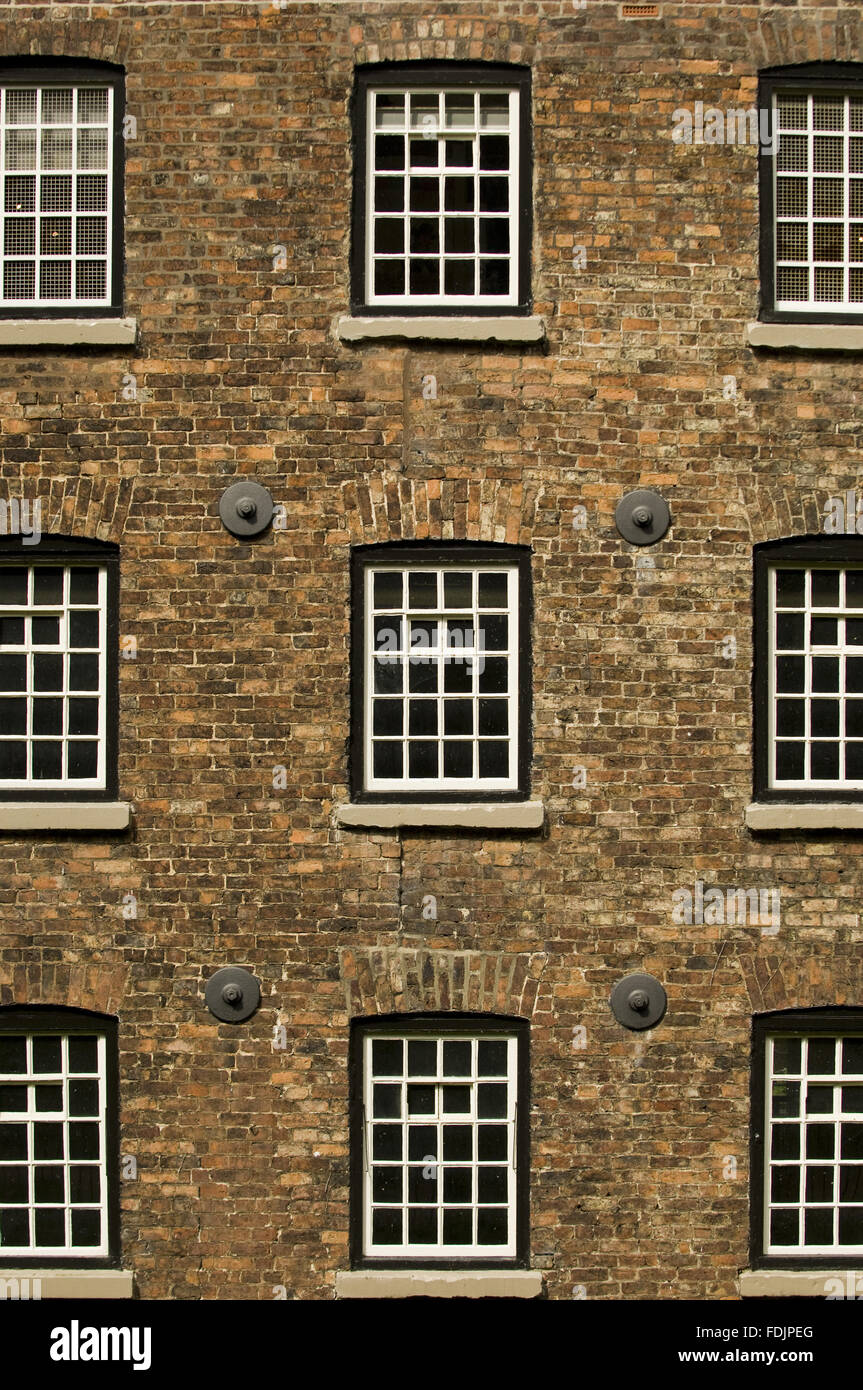 Close view of the exterior of Quarry Bank Mill, Styal, Cheshire. The mill was founded in 1784 and produced cotton until the 1950s. Stock Photo