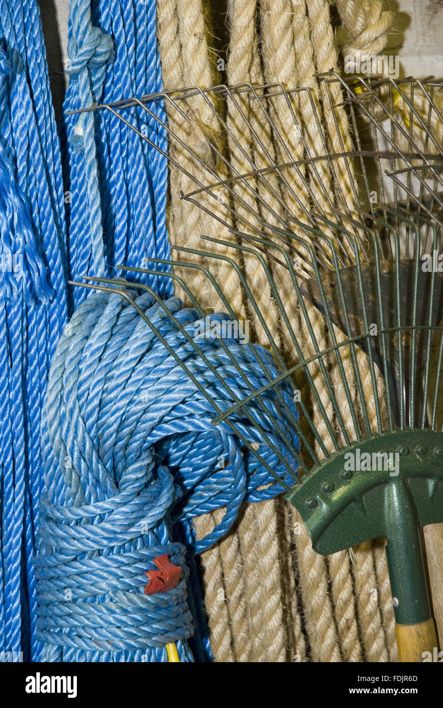Rope and rakes in the gardeners' shed at Castle Drogo, Devon Stock ...