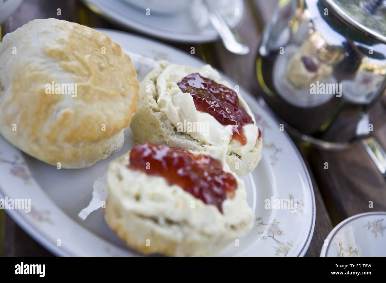 Close up of a cream tea with scones, jam and a pot of tea at Corfe Castle, Dorset. Stock Photo