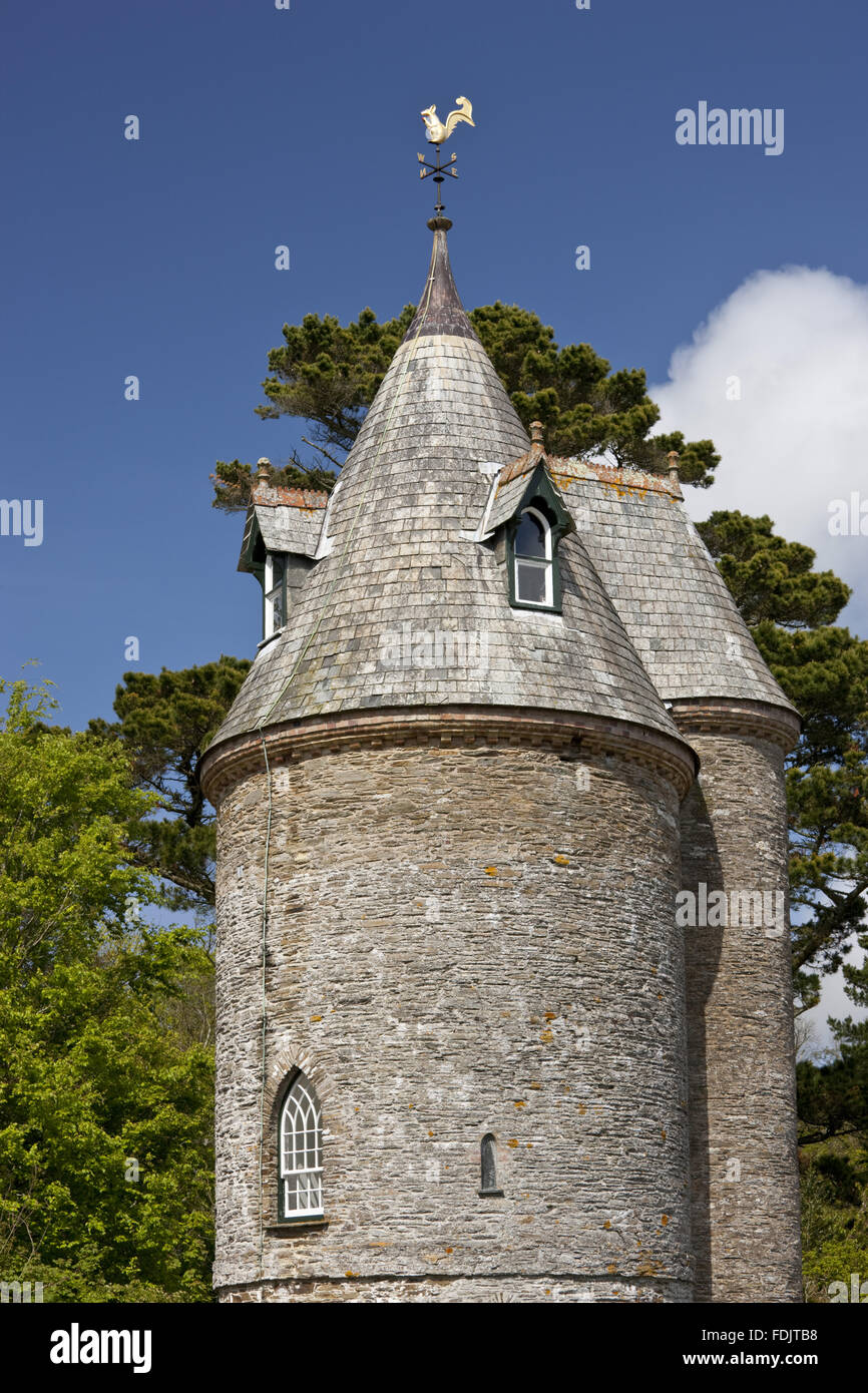 The Water Tower at Trelissick Garden, Cornwall, in May. The building was probably put up in the 1820s, to provide water pressure for the house and garden. The squirrel weathervane was added in the late nineteenth century. The Water Tower is now used as a Stock Photo
