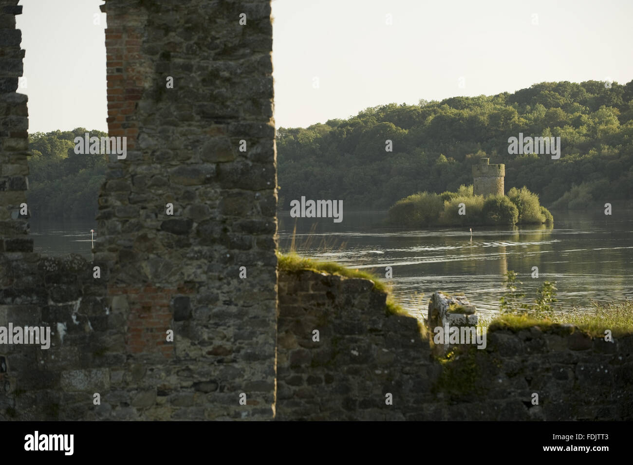 A view from the ruins of the old tower-house towards Crichton Tower on Gad Island in Lough Erne at Crom, Co. Fermanagh, Northern Ireland. Stock Photo