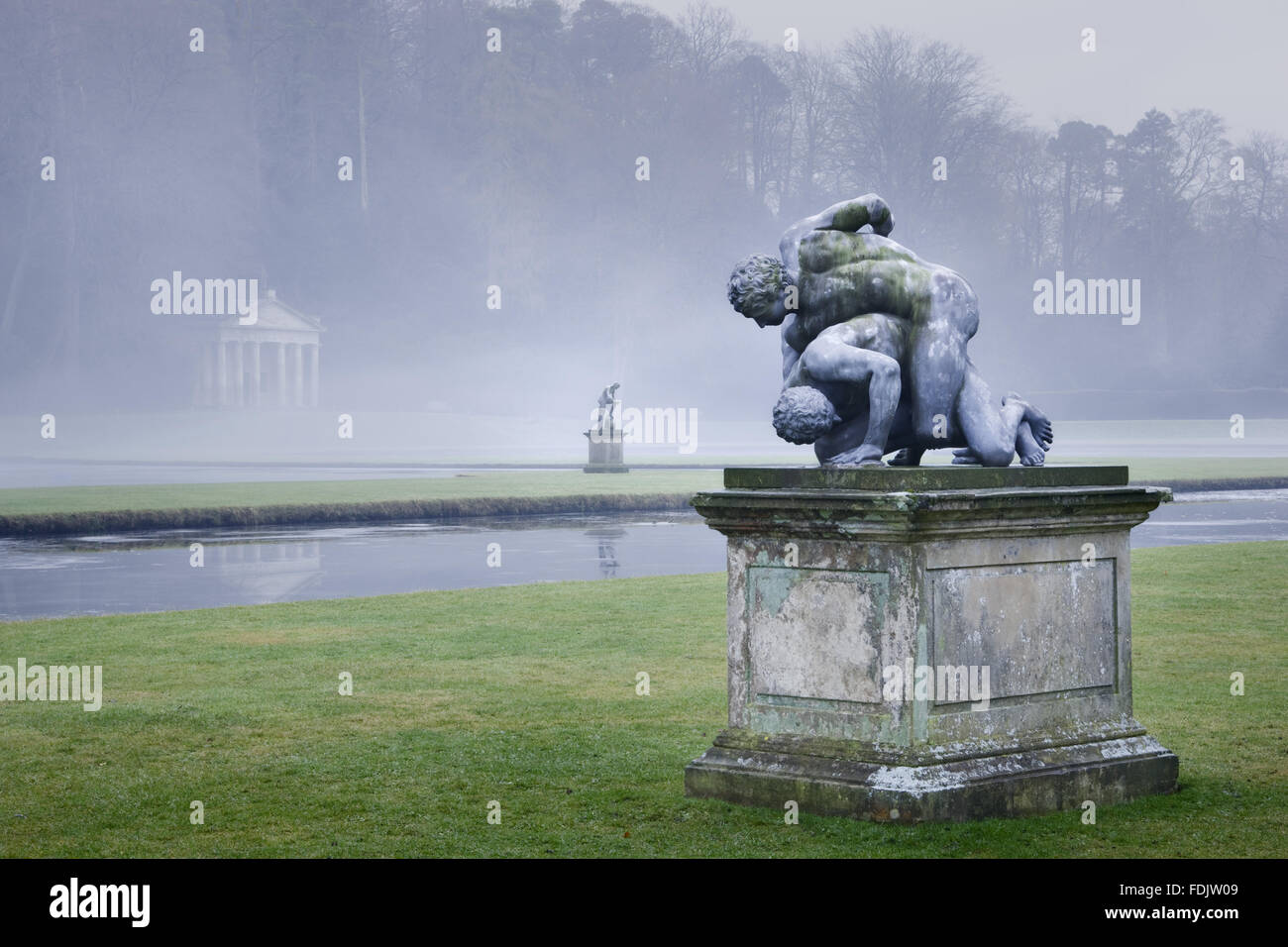 Statue of The Wrestlers at Studley Royal Water Garden, North Yorkshire, photographed in the winter. The gardens were created in 1716 by John Aislabie and continued by his son William in the later eighteenth century. Stock Photo