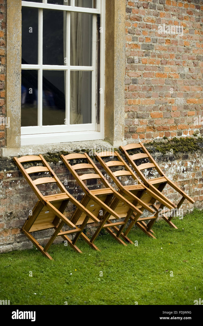 Chairs leaning against the exterior wall at Melford Hall, Suffolk Stock