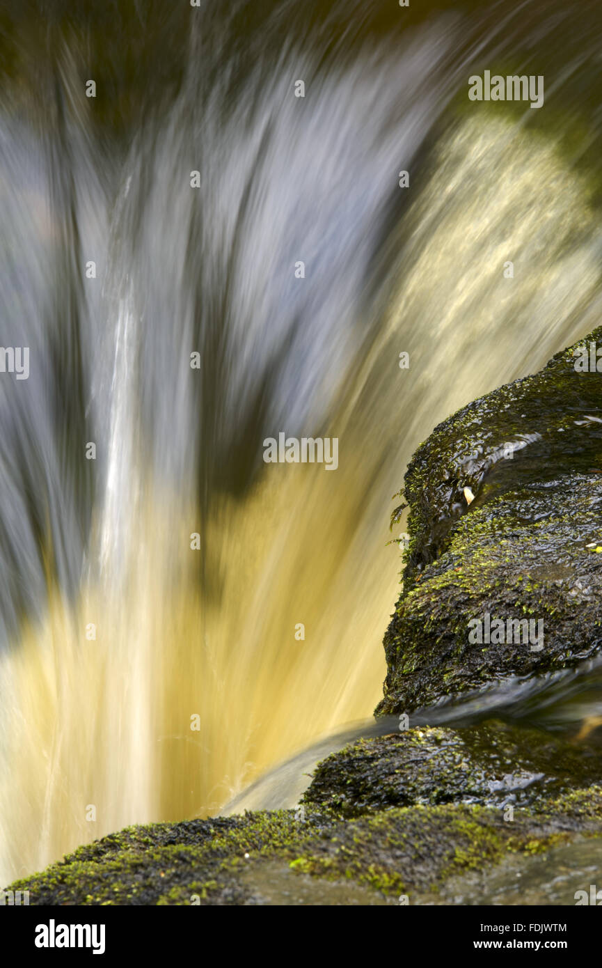 Water rushing over a ledge in the River Wharfe, Langstrothdale, Yorkshire Dales, North Yorkshire. Stock Photo