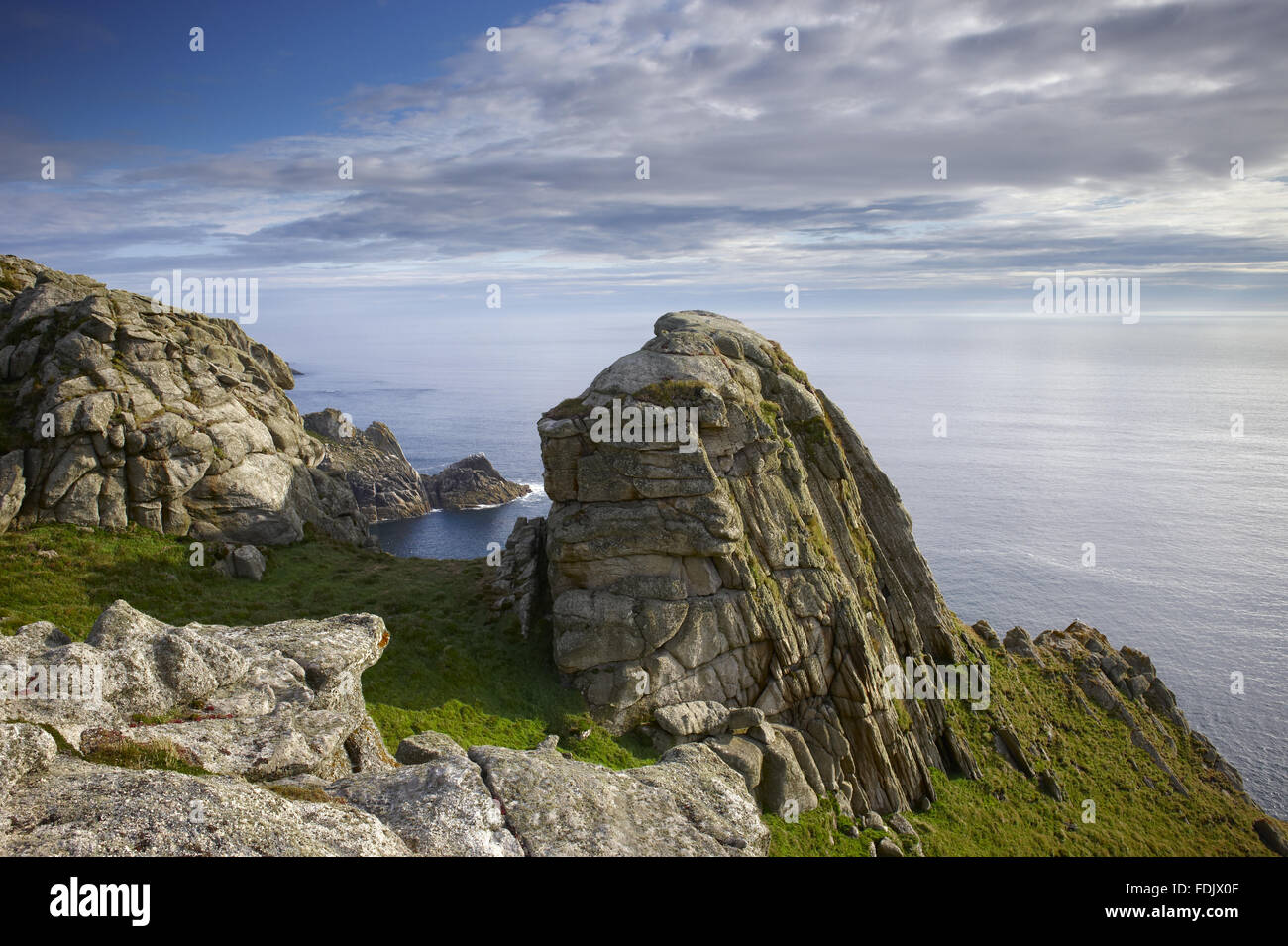 Granite stacks on the west coast of Lundy. The island is a Site of Special Scientific Interest, 18 kilometres off the north Devon coast, and is owned by The National Trust, but is financed, administered and maintained by the Landmark Trust. Stock Photo