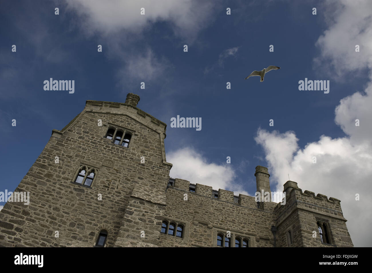 Looking up at the castellated tower of the medieval castle on St Michael's Mount, Cornwall. Stock Photo