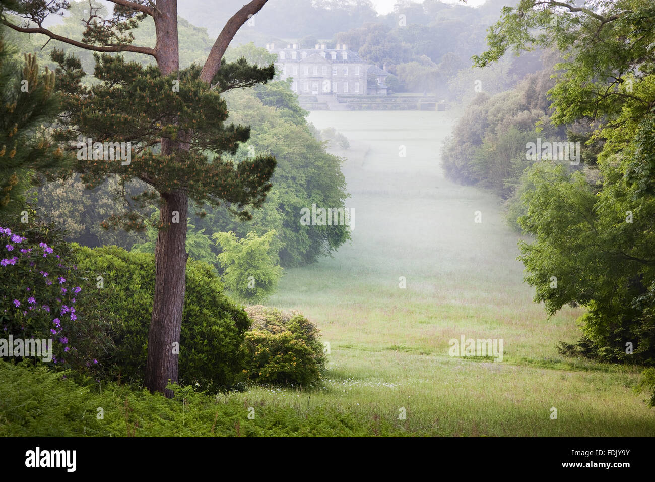 The view from Jupiter Point down to the house at Antony, Cornwall. Stock Photo