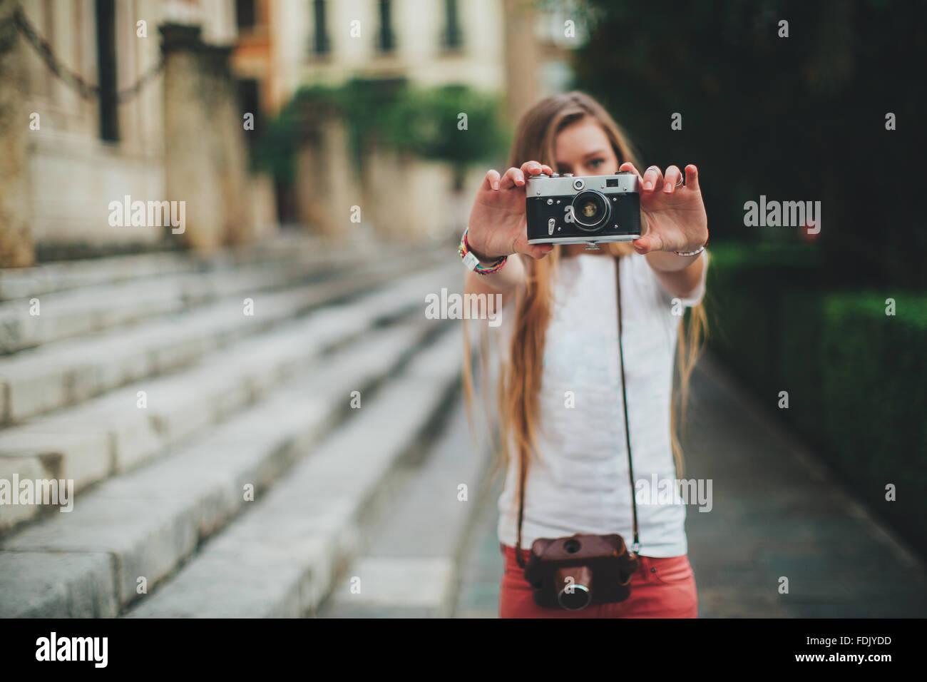 Young woman holding retro film camera, Seville, Spain Stock Photo Alamy