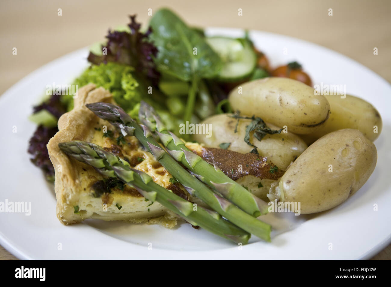 Quiche with asparagus and salad, available in the restaurant at Polesden Lacey, Surrey. Stock Photo