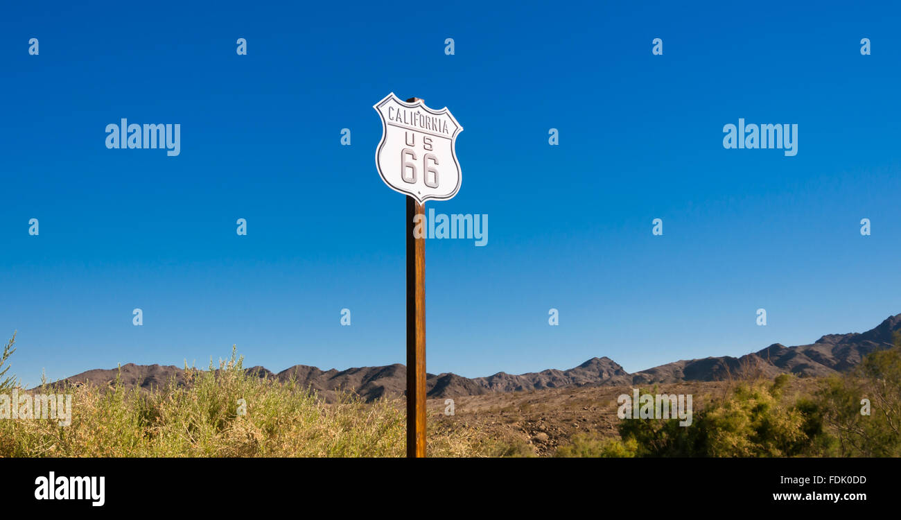 A scenic view of a historic Route 66 sign with a sky blue background, Arizona, USA Stock Photo