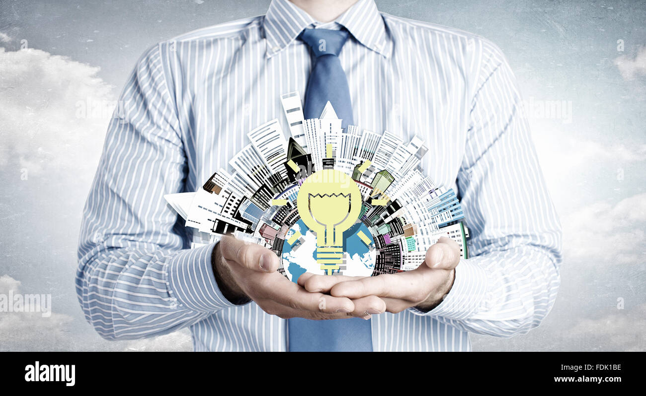 Close up of businessman holding city model in hands Stock Photo - Alamy
