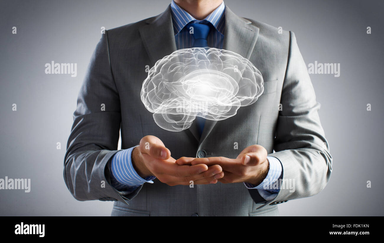 Close up of businessman hands holding brain in palm Stock Photo - Alamy