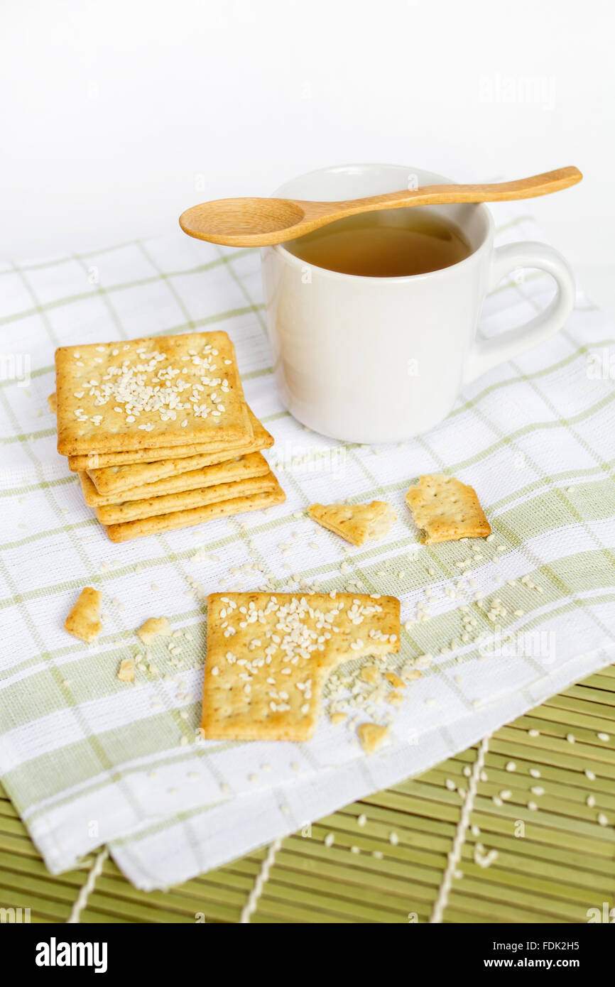 Wholewheat crackers with sesame seeds and tea Stock Photo Alamy