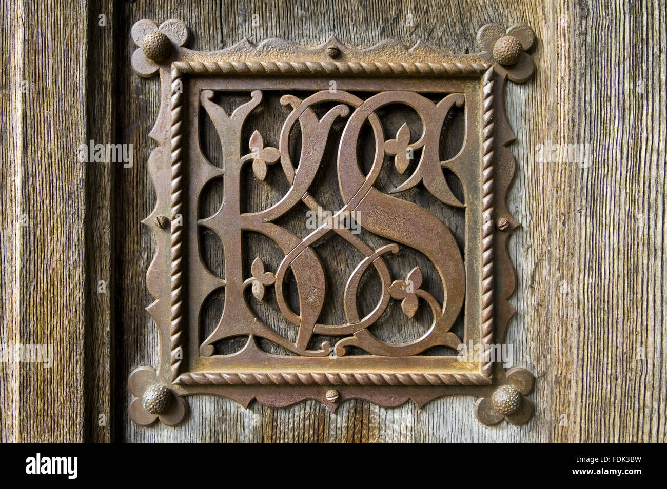 Detail of the ironwork 'KS' (for Kay-Shuttleworth) monogram designed by Pugin on the front door at Gawthorpe Hall, Lancashire. Stock Photo