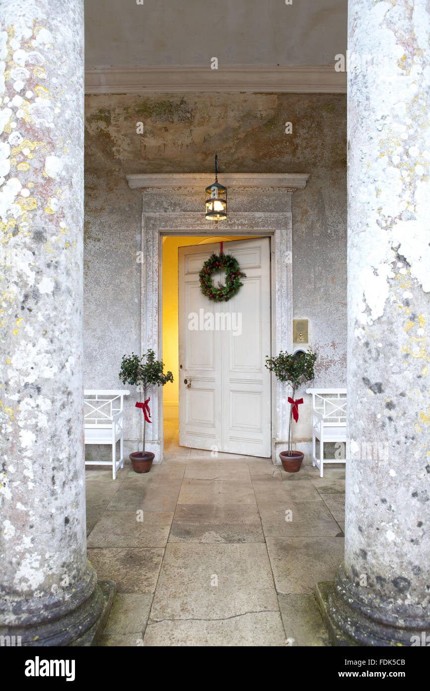 Christmas decorations at the front door at Uppark, West Sussex. Stock Photo
