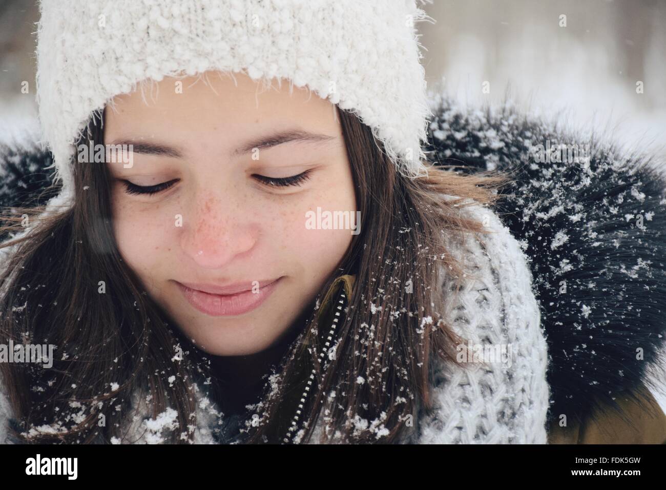 Smiling girl standing outdoors in the snow Stock Photo - Alamy