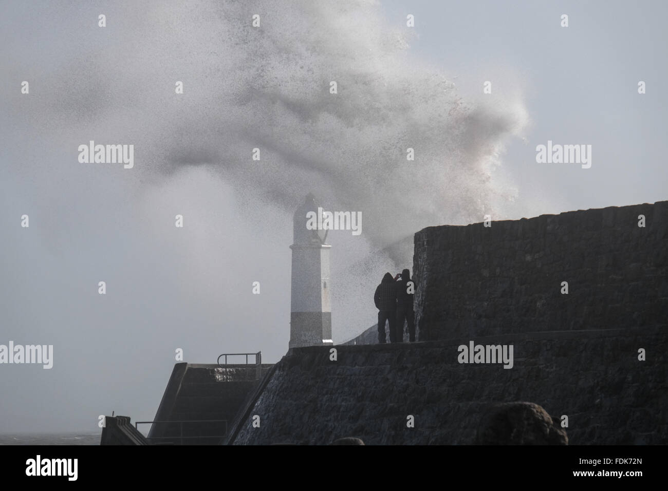Porthcawl, Wales, UK. 1st February, 2016. Storm Henry brings widespread high winds sweeping across south Wales. Waves crash against Porthcawl lightouse and harbour wall. Credit:  Algis Motuza/Alamy Live News Stock Photo