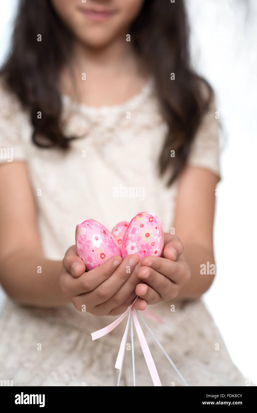 Girl holding a handful of Easter Eggs Stock Photo