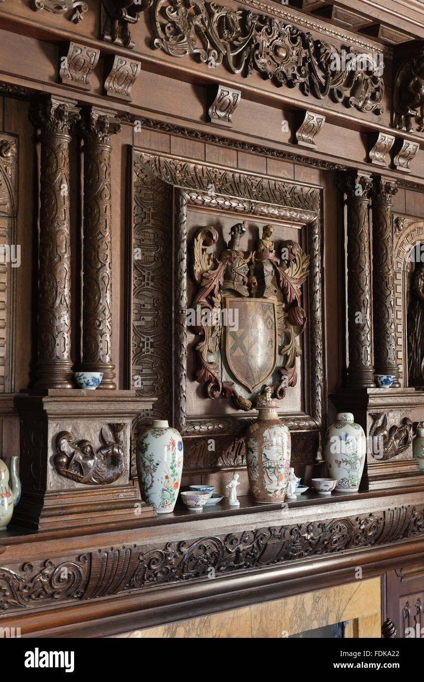 The carved wooden coat of arms above the chimneypiece in the Tapestry Room, The Vyne, Hampshire. The chimneypiece was formerly in the Dining Parlour. Stock Photo
