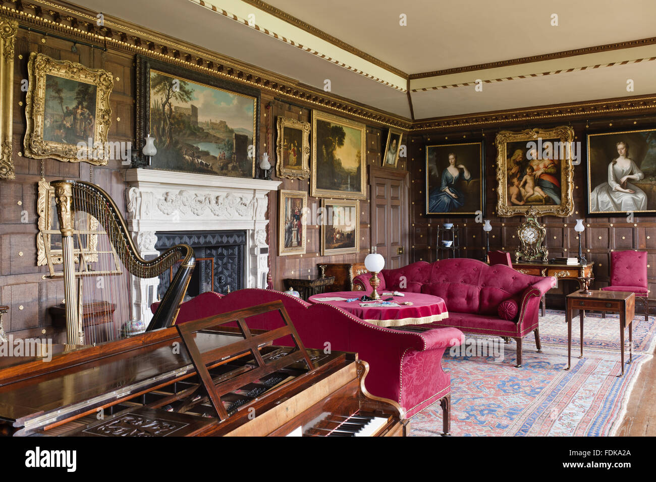The Saloon, The Vyne, Hampshire. The Broadwood piano in veneered rosewood is English, c.1846, and the Grecian harp is an Erard, c.1825-7. Stock Photo