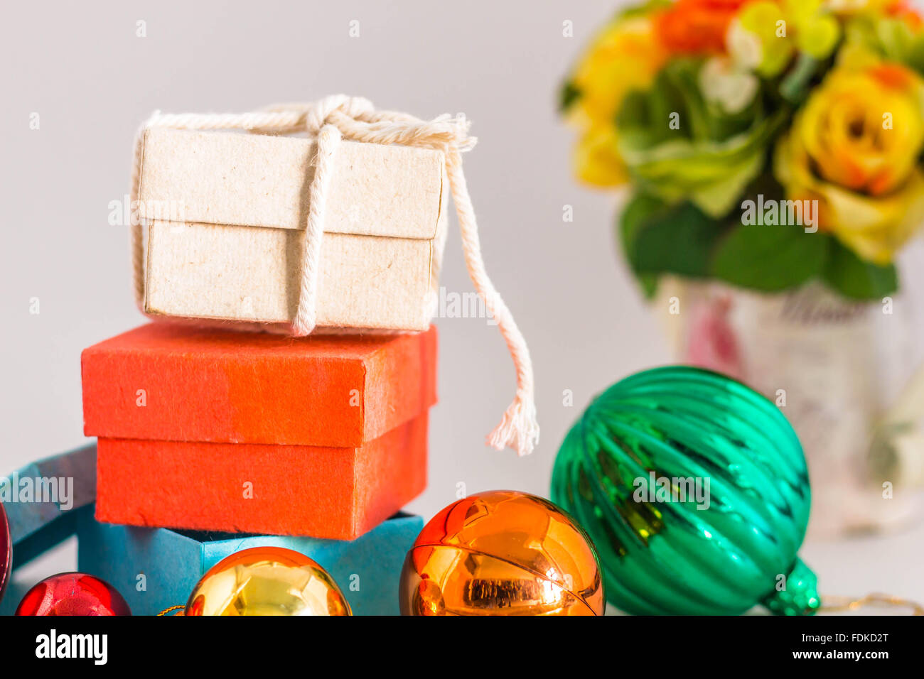 Gift boxes and balls for the festival on a white background Stock Photo ...