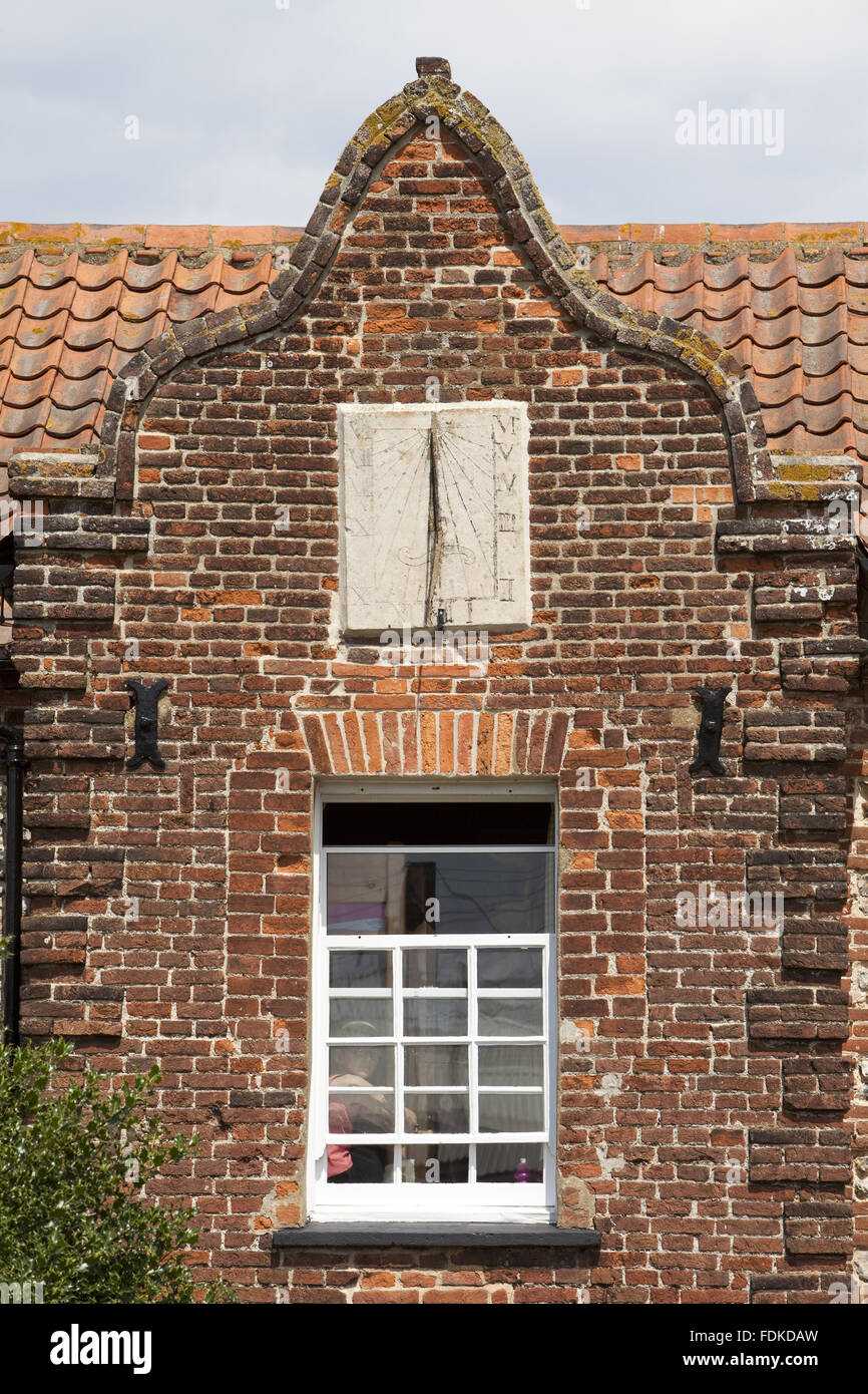 The sundial above a window at Brancaster Millennium Activity Centre