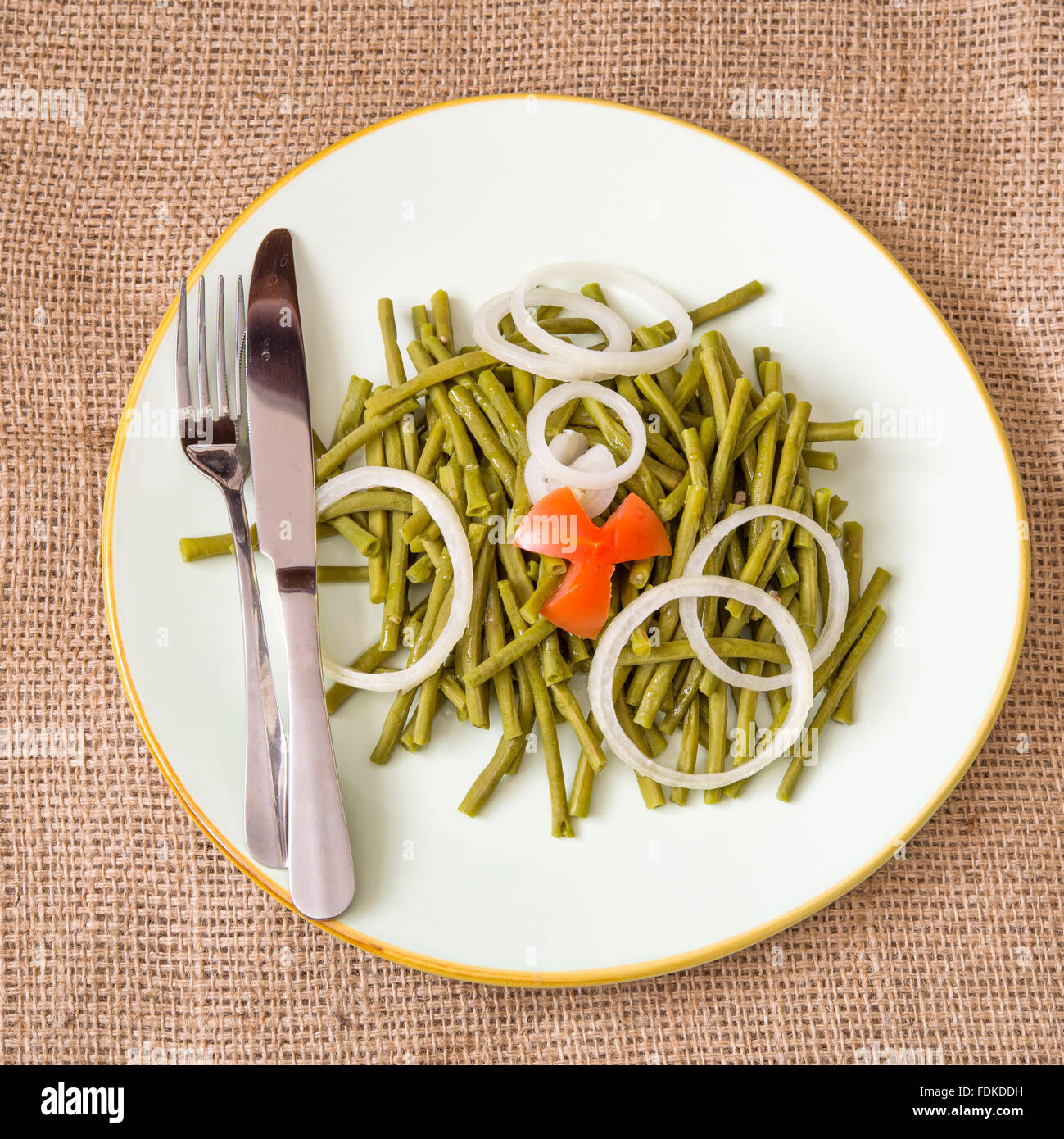 Cooked long Chinese green beans. Delicious salad that only uses oil and vinegar as dressing. The plate is garnished with a star Stock Photo