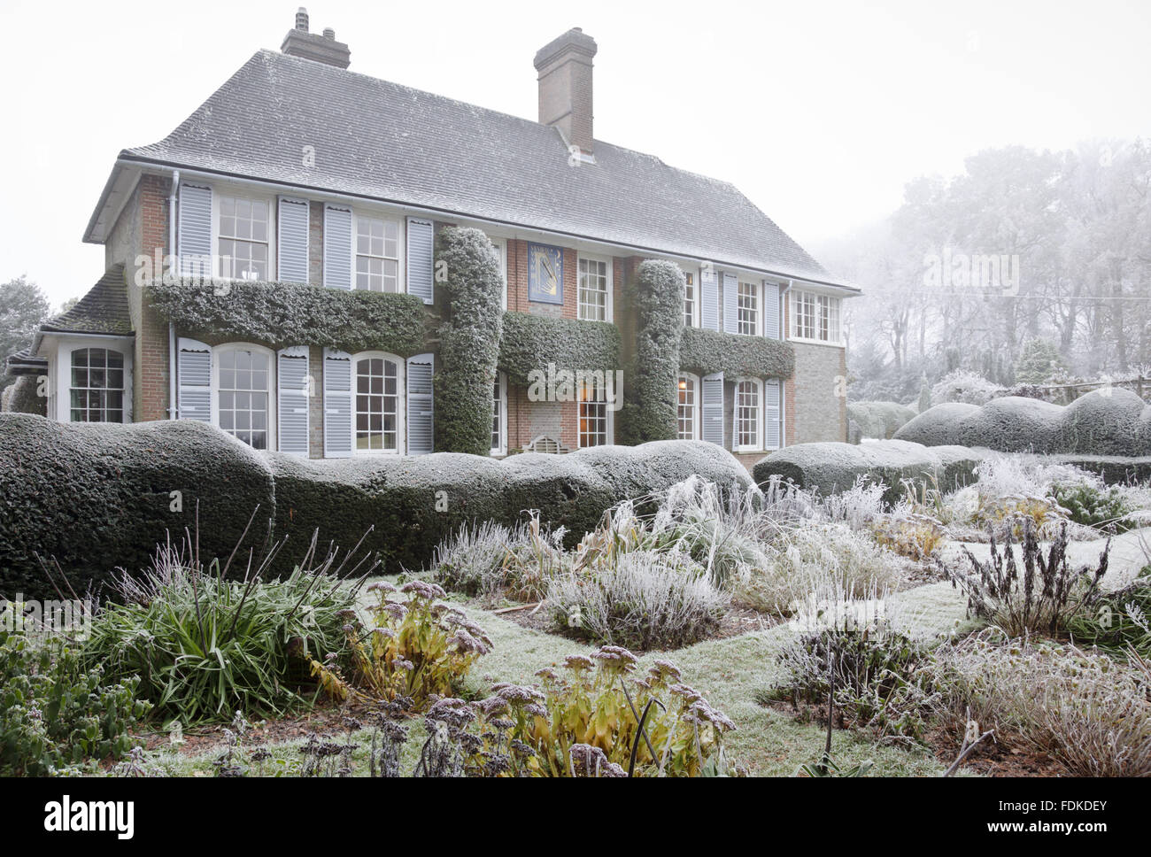 The west front of the house and garden in winter at Nuffield Place, Oxfordshire. The house was designed by Oswald Partridge Milne, a pupil of Lutyens, and built in 1914. Nuffield Place was the home of William Morris, Lord Nuffield, motor manufacturer, fro Stock Photo