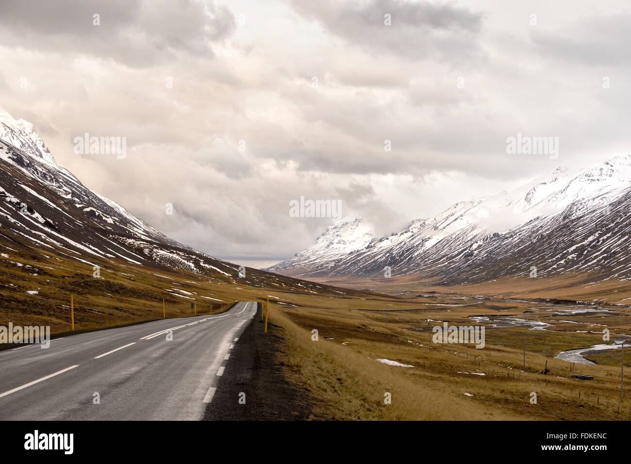 Icelandic road through glacial valley in Oxnadalur. Stock Photo