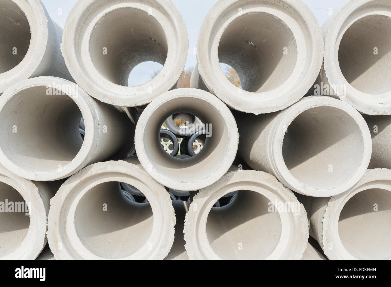 Concrete drainage pipes for industrial building construction. Stock Photo