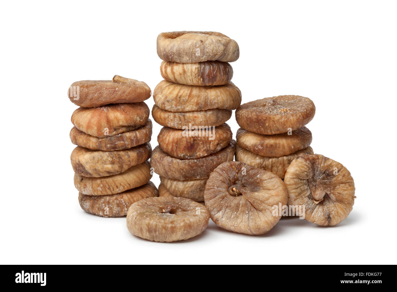 Dried figs in rows on white background Stock Photo