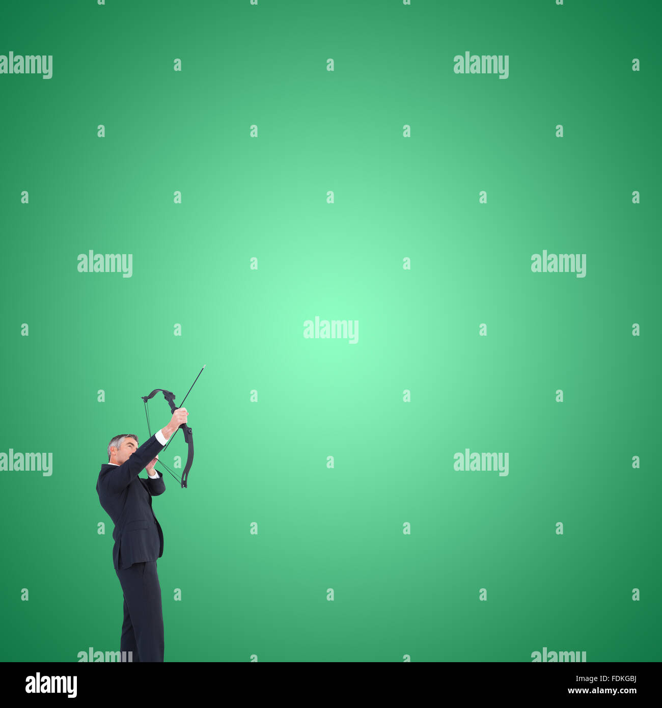 Composite image of businessman shooting bow and arrow Stock Photo