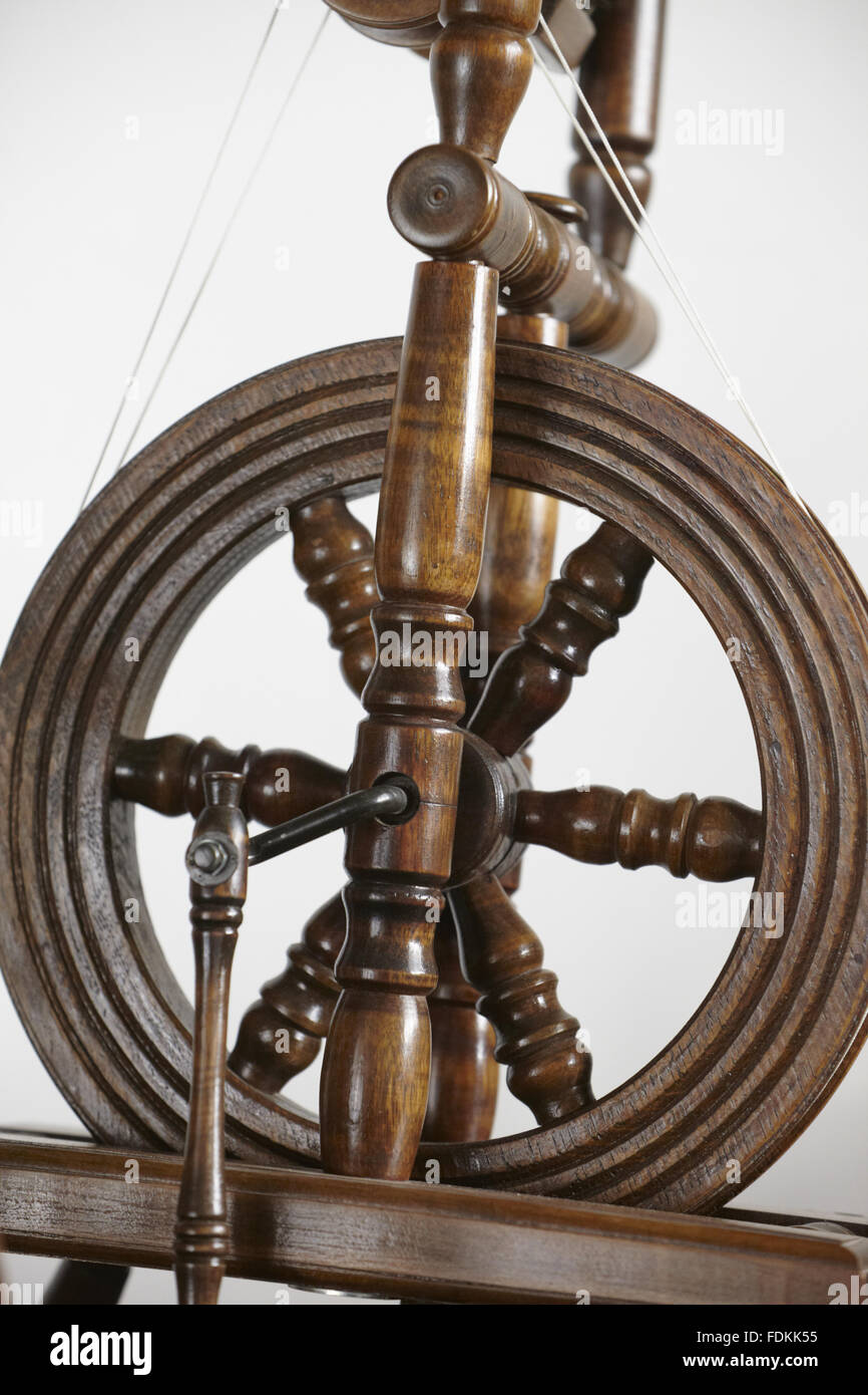 Close view of part of a wooden spinning wheel at Moseley Old Hall, Staffordshire. Inventory number: 477580 Stock Photo