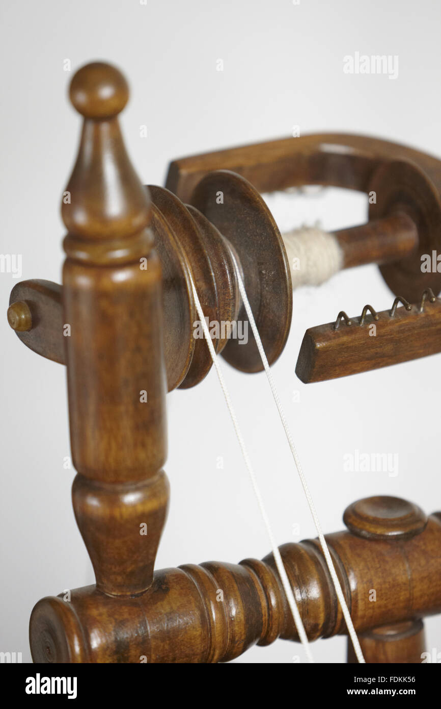 Close view of part of a wooden spinning wheel at Moseley Old Hall, Staffordshire. Inventory number: 477580 Stock Photo